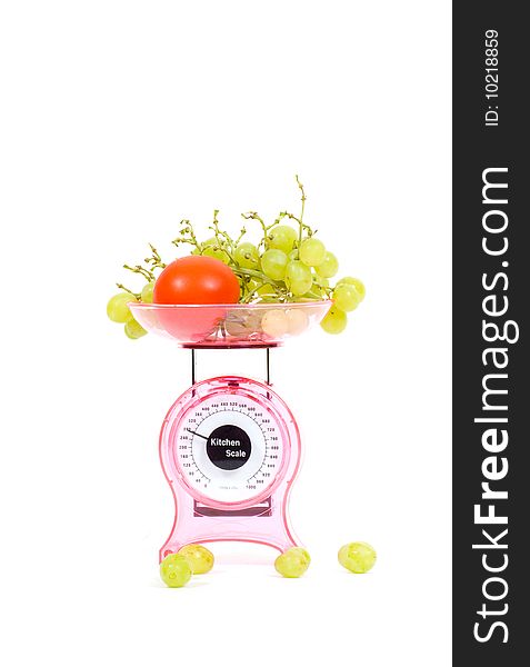 Kitchen Scales with fresh tomatoes and grapes