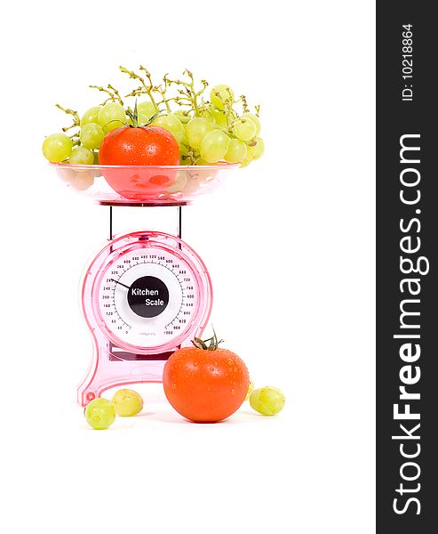 Kitchen Scales With Tomatoes And Grapes
