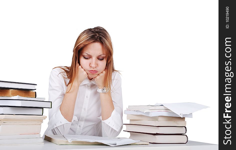 Worried nice brunette girl between lot of books. Worried nice brunette girl between lot of books