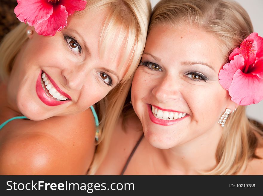 Beautiful Smiling Girls With Hibiscus Flowers