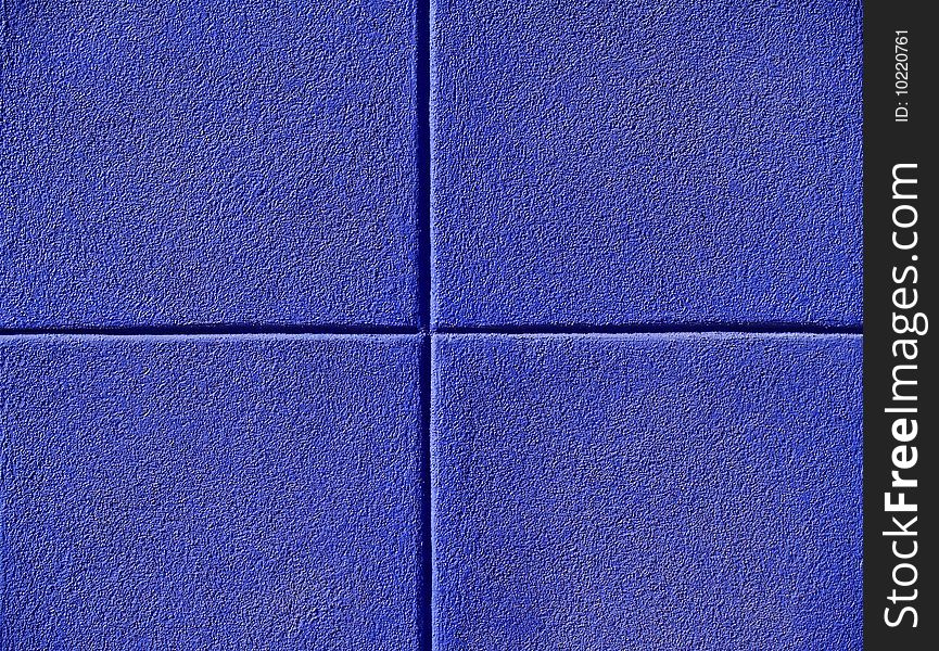 Four blue squares on a concrete wall, powerpoint background and copy space.