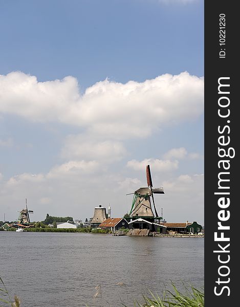 Dutch windmill on a canals edge. Dutch windmill on a canals edge
