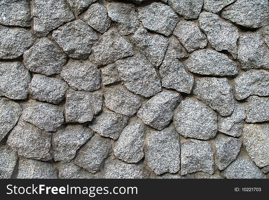 Fragment of an old stone wall