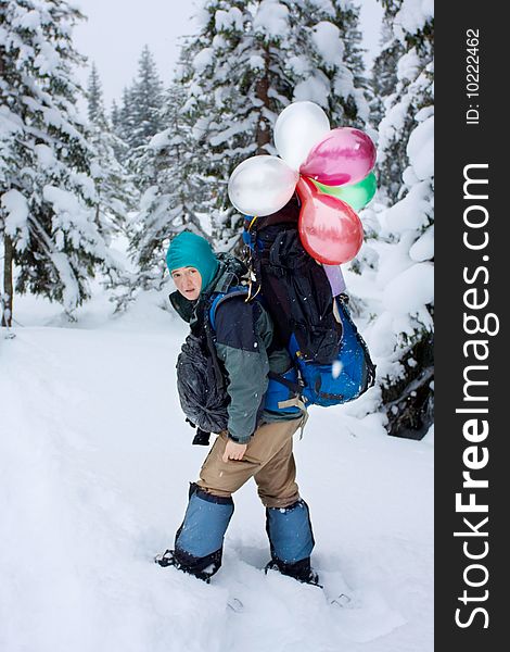 Hiker in winter in mountains