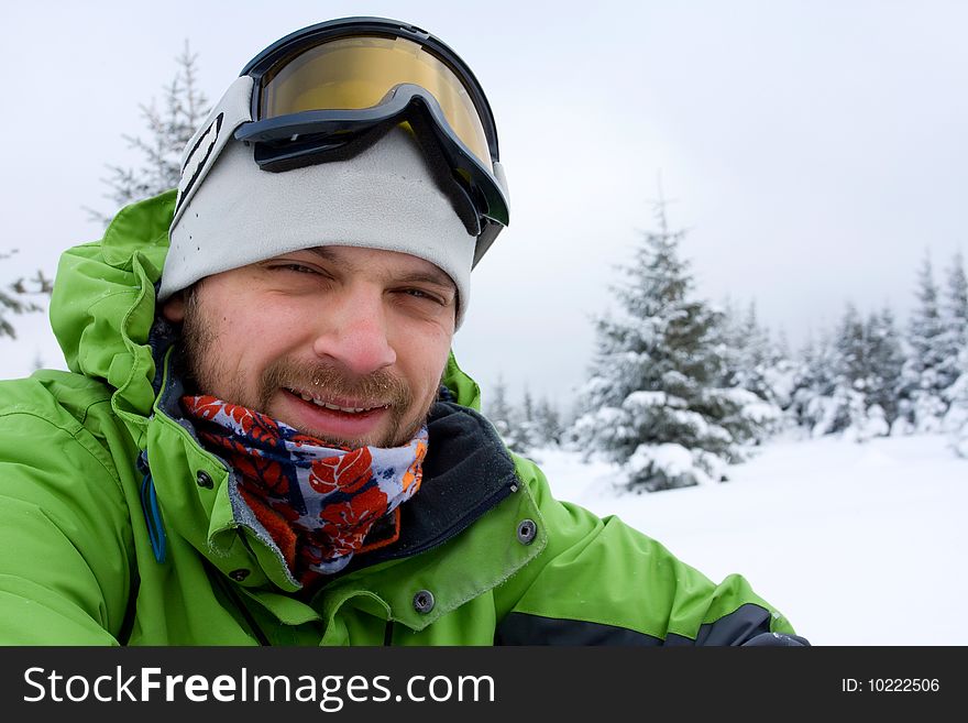 Hiker in winter in mountains