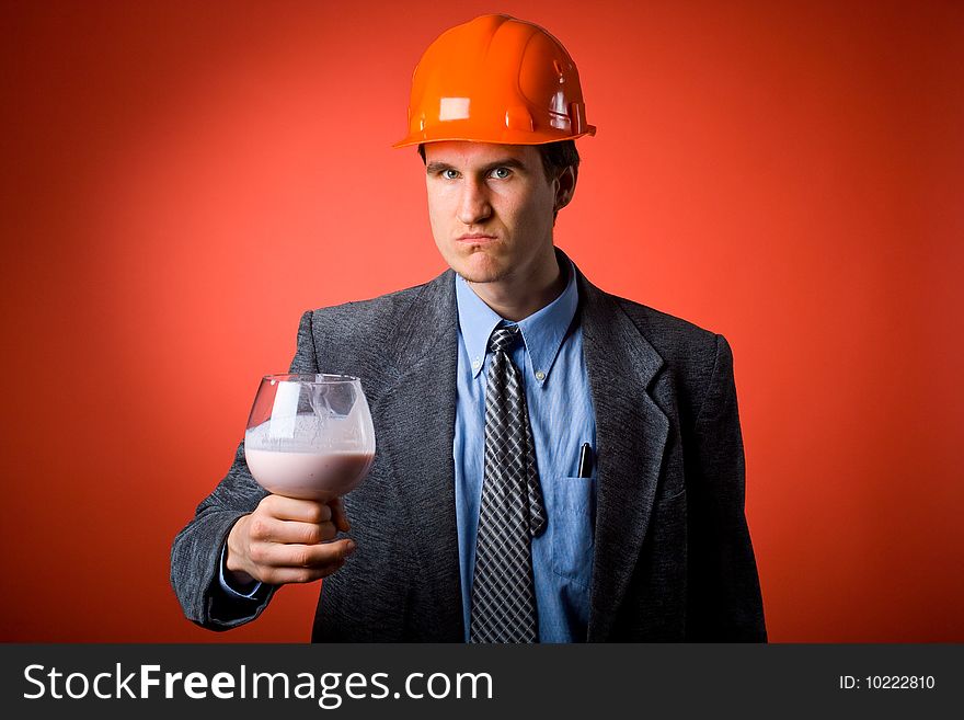The man in a helmet with a hammer and yoghurt
