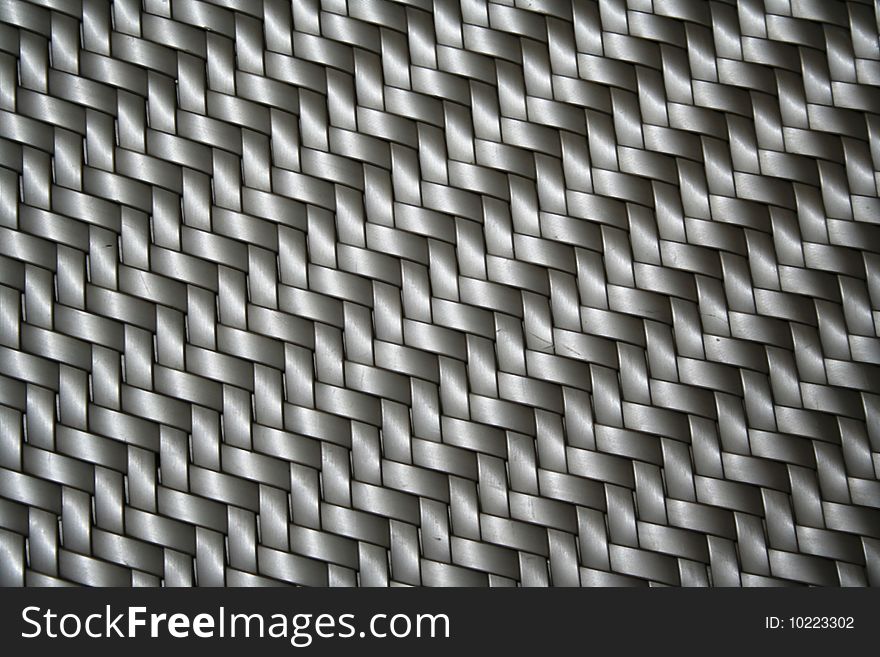 Piece of silver plastic texture taken from chair in hotel