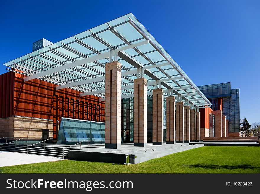 Modern office building with a glass roof and columns