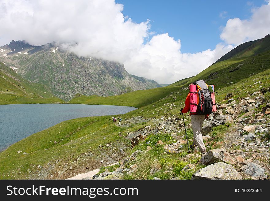Hiker boy in Caucasus mountains