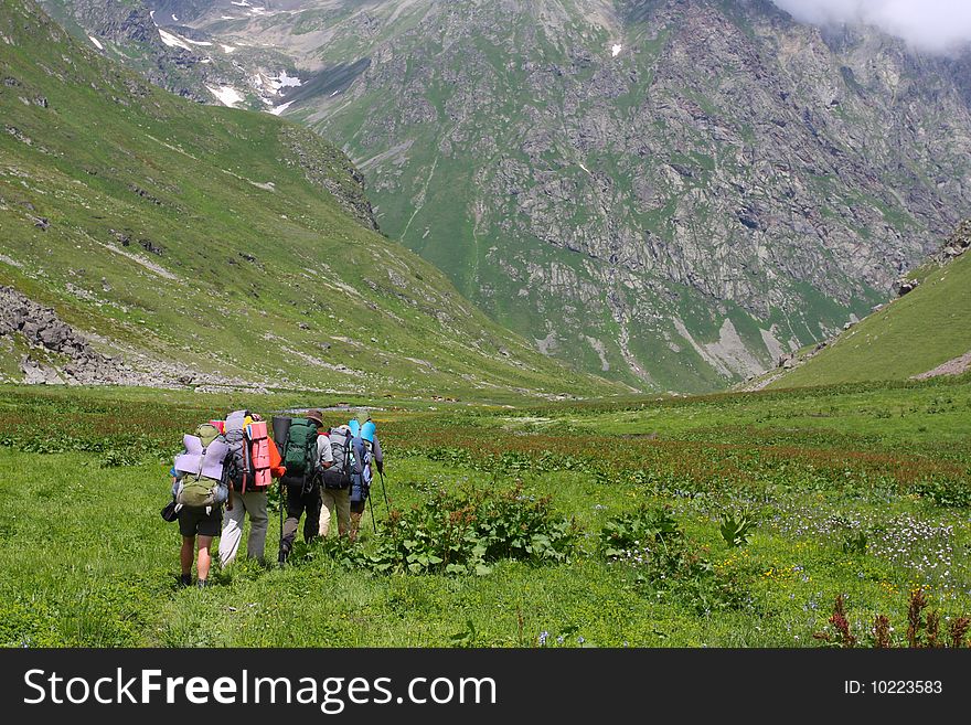 Hikers family in Caucasus mountains