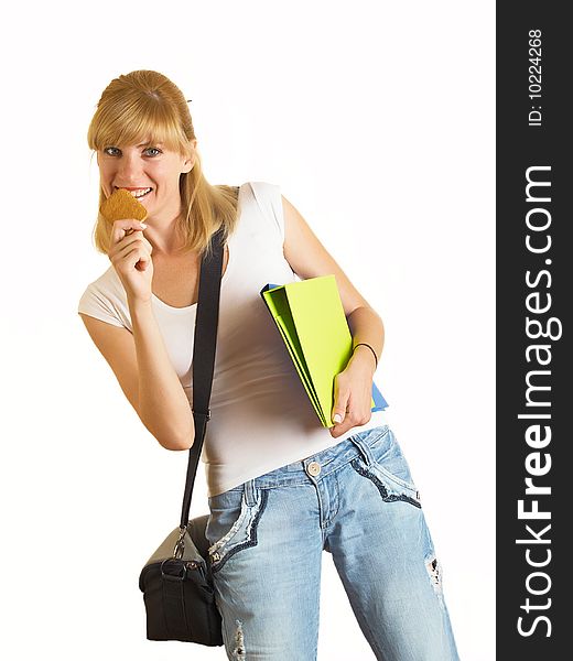 Portrait of a young attractive student it eats cookies on the white background. Portrait of a young attractive student it eats cookies on the white background