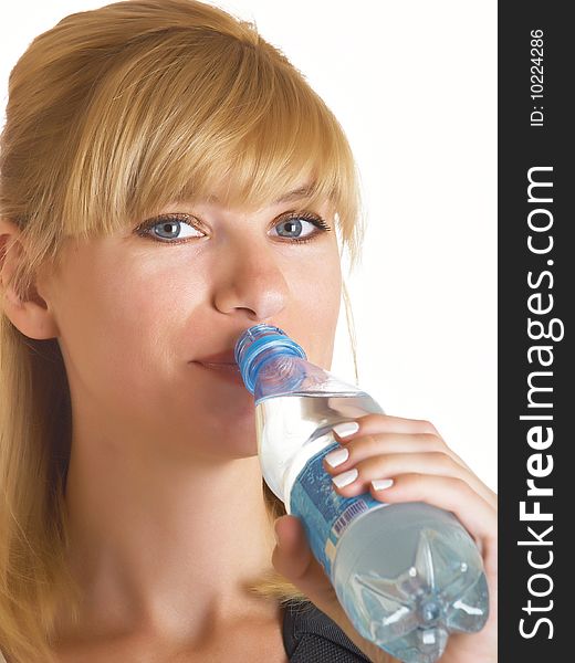 Woman drinking water on the white background. Woman drinking water on the white background