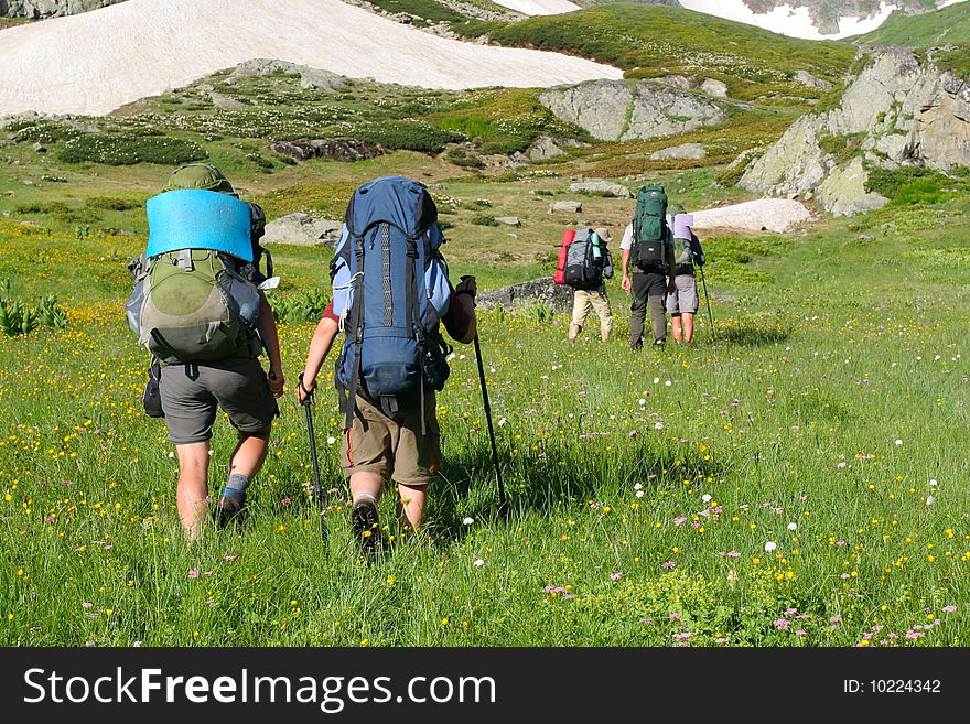 Hikers family in Caucasus mountains