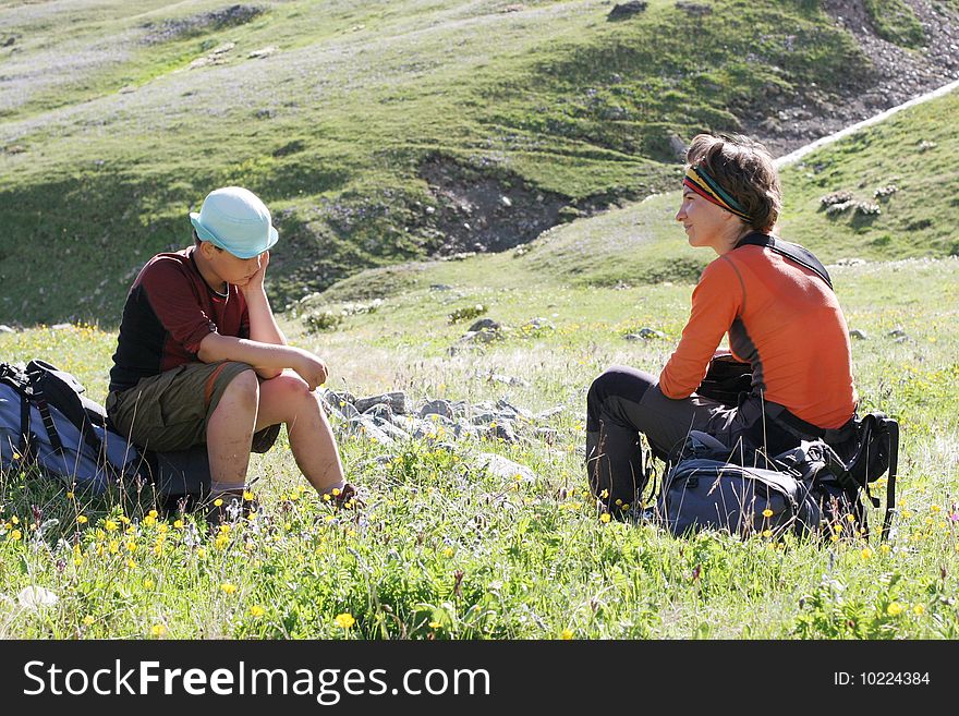 Hikers family in Caucasus mountains