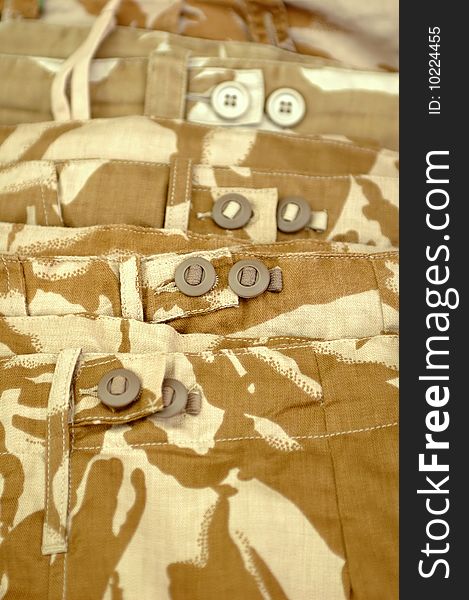 Beige military desert camouflage clothing close-up