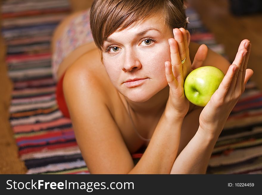 Young woman with green apple. Young woman with green apple