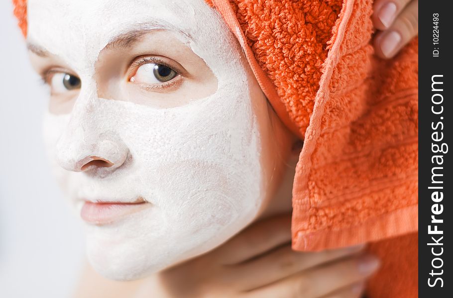 Young woman with face pack