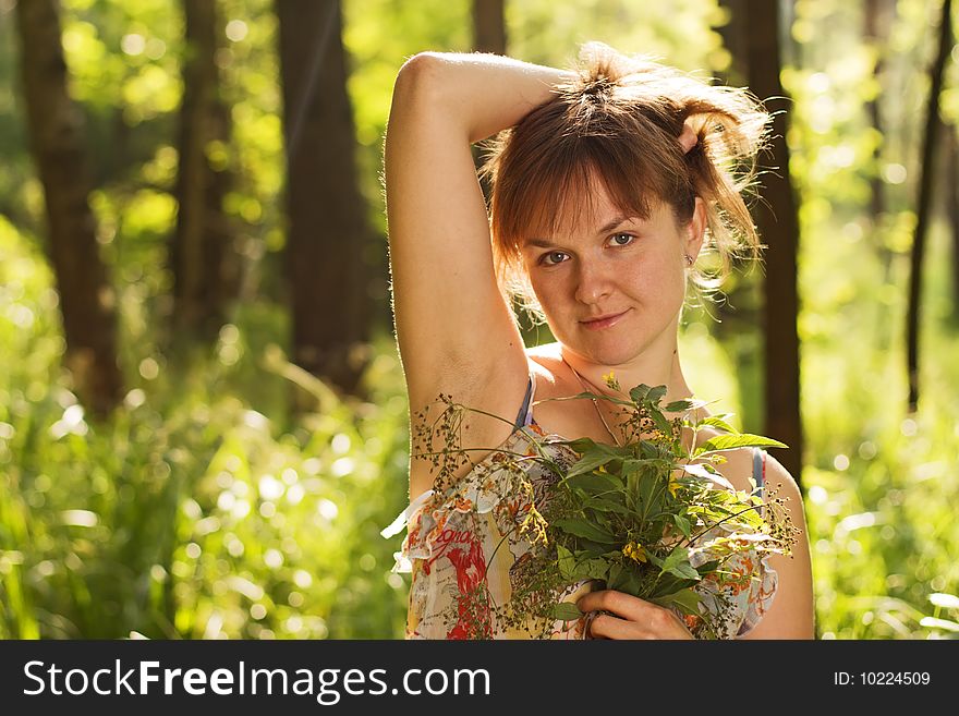 Girl with flowers in the forest. Girl with flowers in the forest