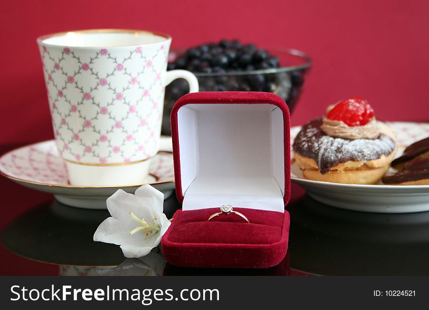 Romantic breakfast with a cake,coffee and wedding ring