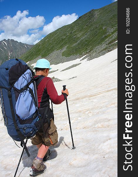 Hiker boy in Caucasus mountains