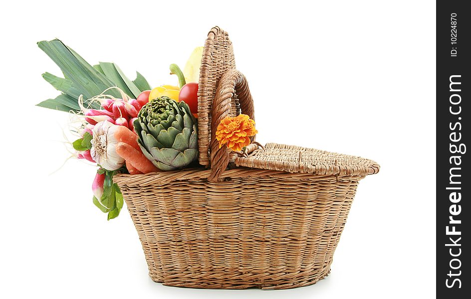 Vegetable into wicker basket isolated on white background. Vegetable into wicker basket isolated on white background