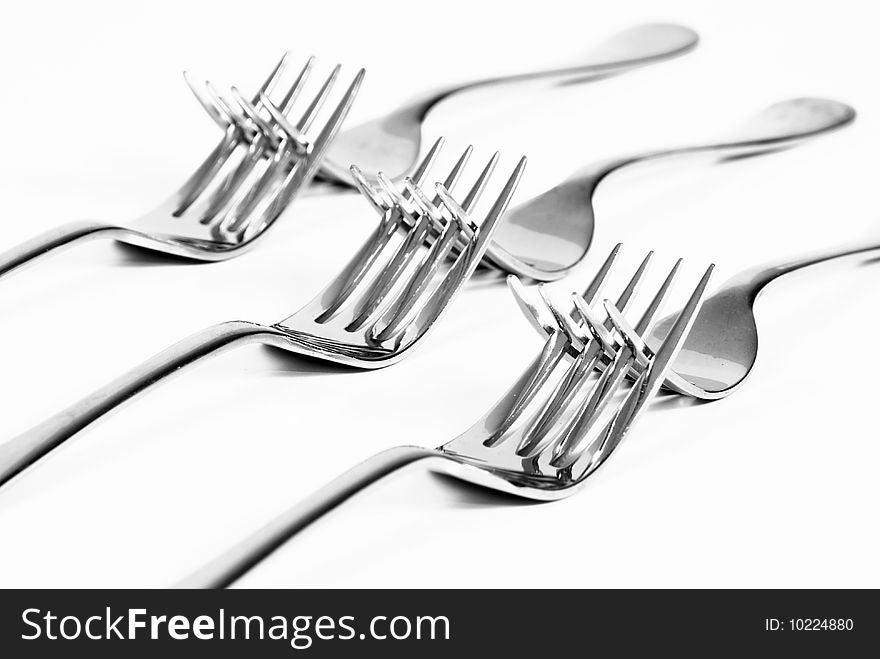 Forks entangled with each other. Forks entangled with each other