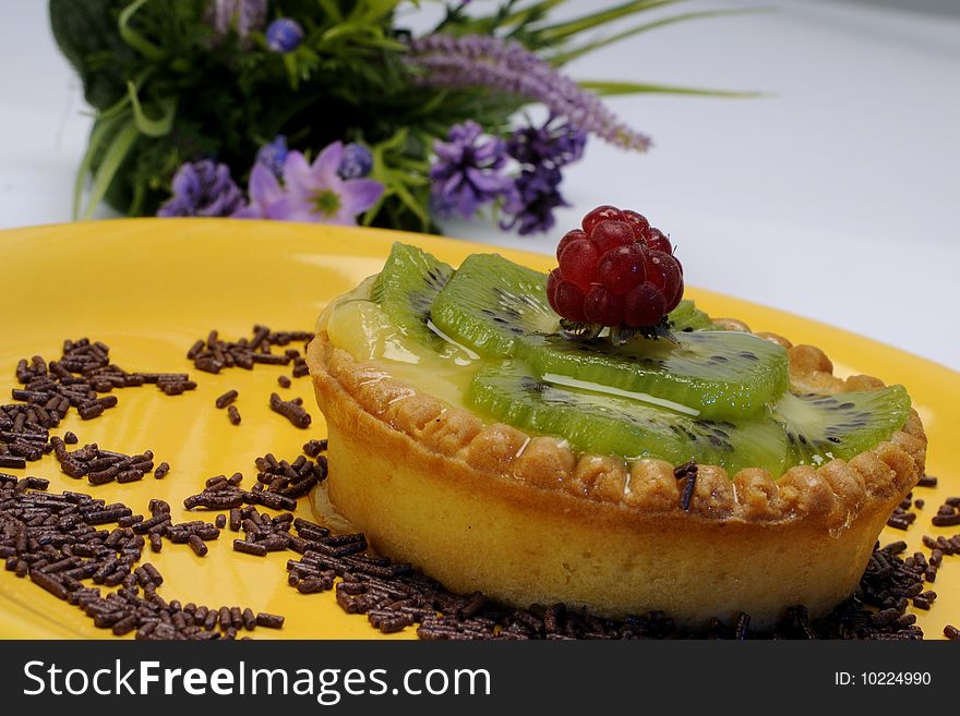 Closeup with tasty cakes on yellow plate