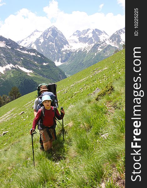 Hikers family in Caucasus mountains