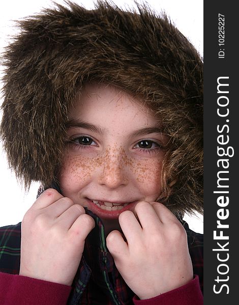 Cute girl with freckles in warm,fuzzy hood