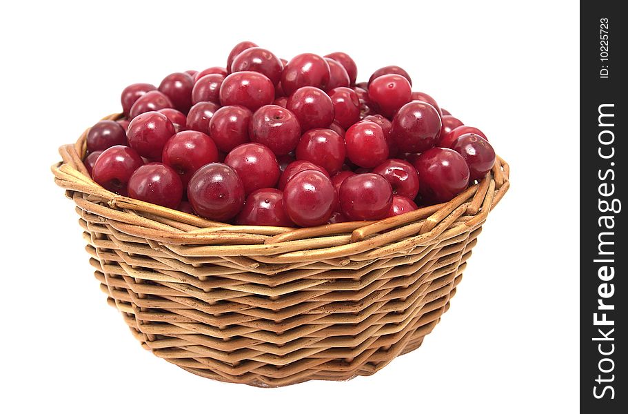 Cherries in a basket isolated on white