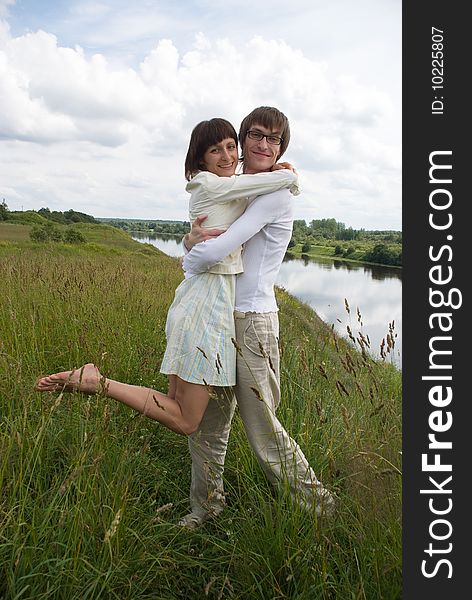 Boy and girl on a green grass. Boy and girl on a green grass