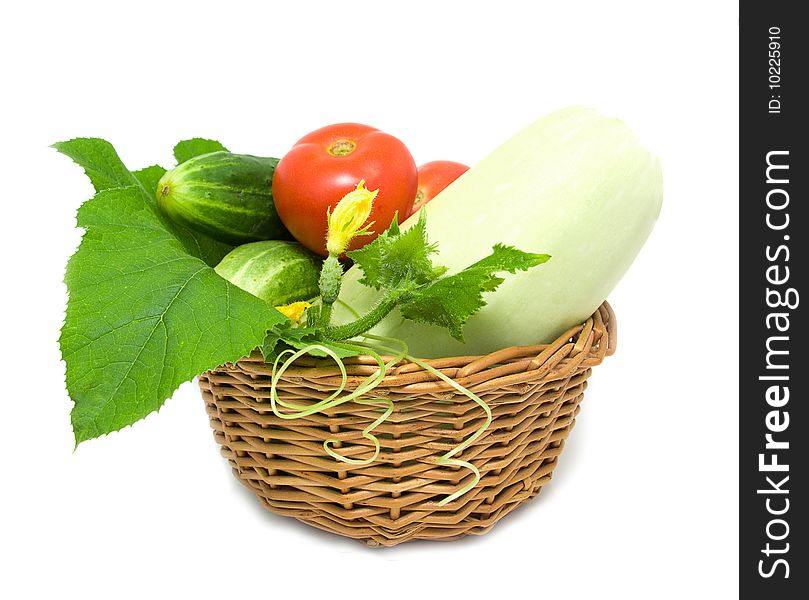 Cucumbers, tomato and marrow in a basket. Cucumbers, tomato and marrow in a basket