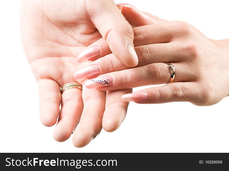 Photo of male and female hands with rings