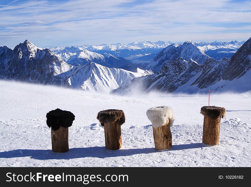 Row of stools in front of mountain panorama. Row of stools in front of mountain panorama