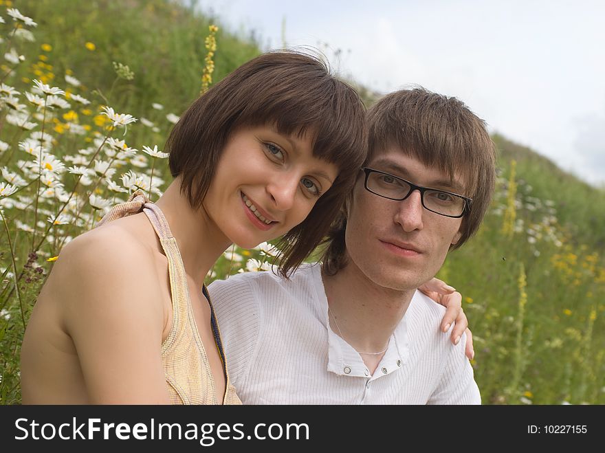 Boy and girl on a green grass. Boy and girl on a green grass