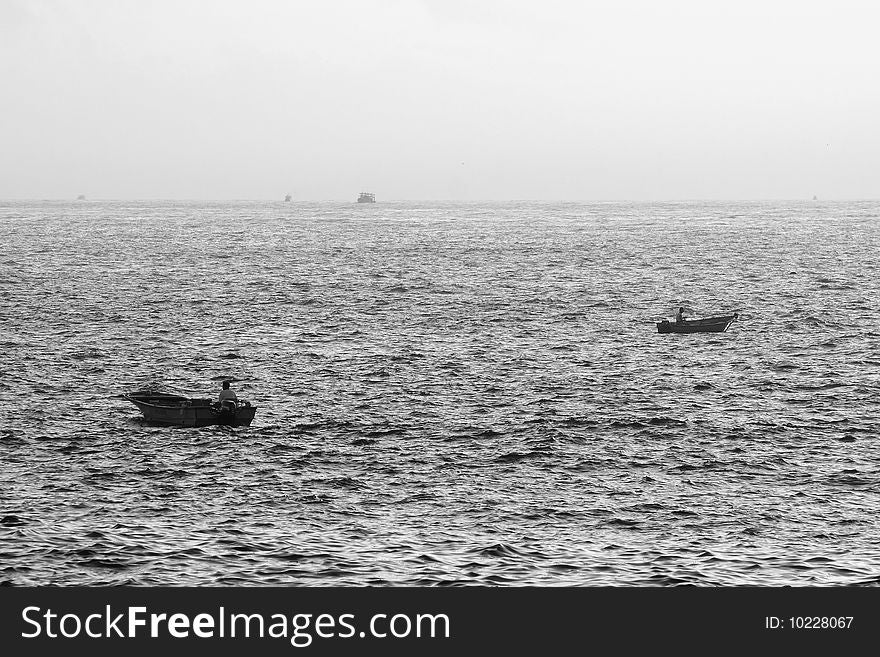 The working fishermen drive boats to fish