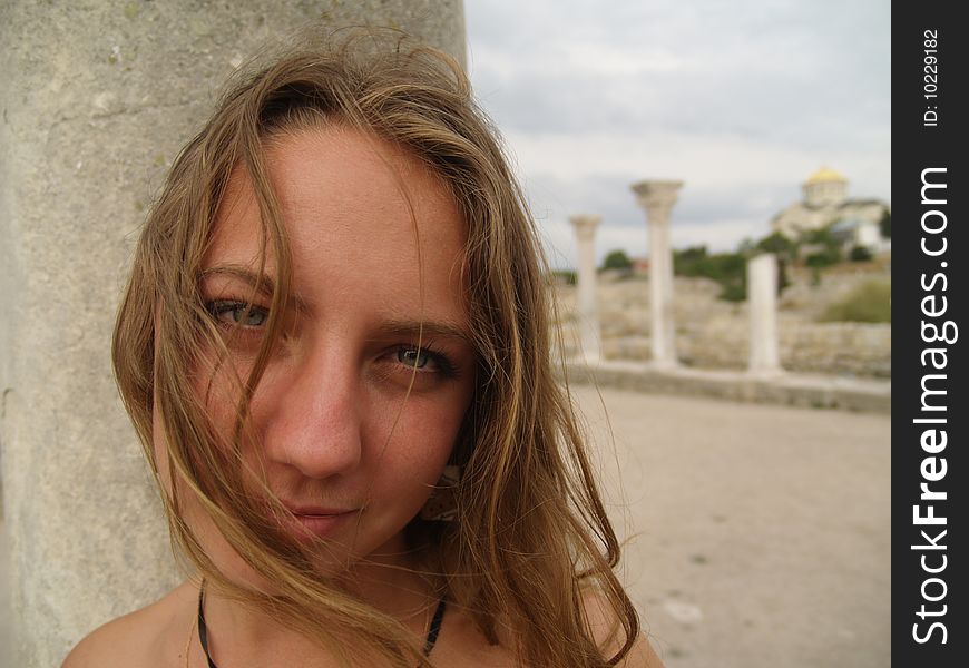 Beautiful Girl In A Long Skirt Near The Columns.