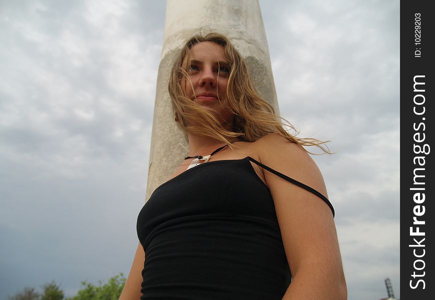 Beautiful Girl In A Long Skirt Near The Columns.