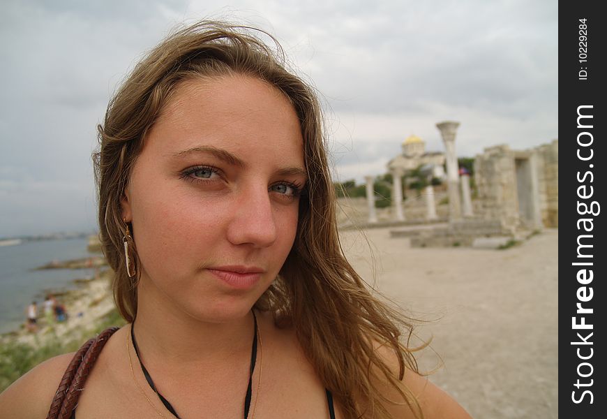 Womans portret near ruins of cathedral in Hersones