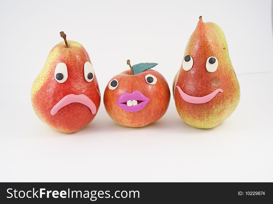 Funny fruit manikins. Apple and two pears.