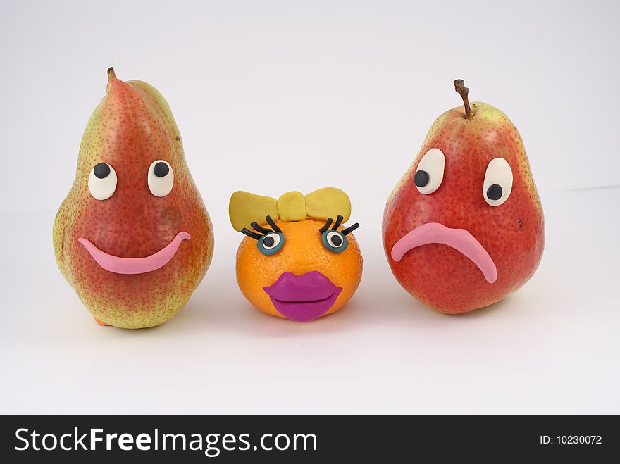 Pears and mandarine. Funny fruit are manikins.
