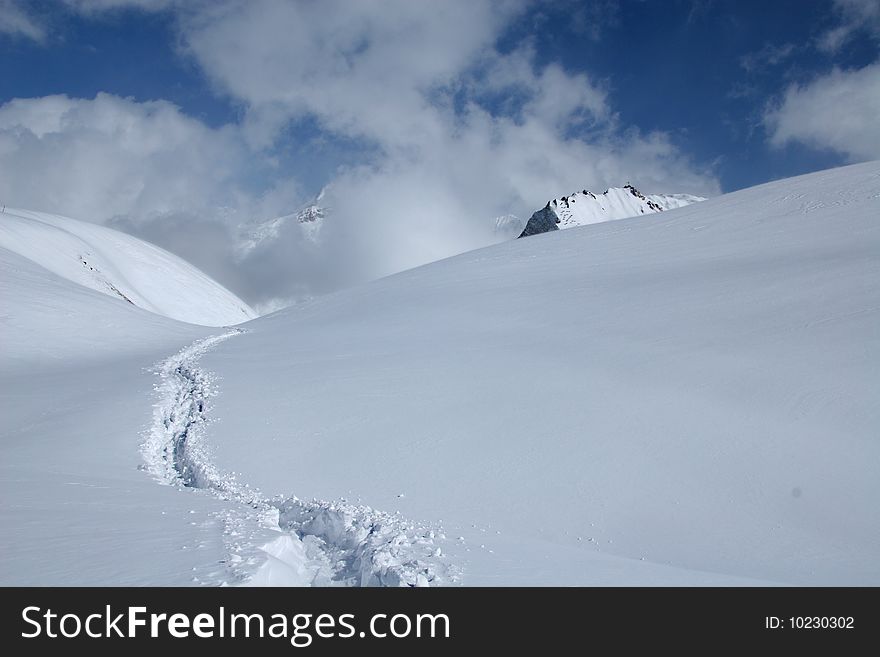 Track in a deep snow in the mountains of Alpes in France