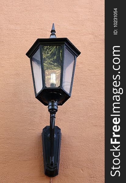 Street lamp hang on brown wall