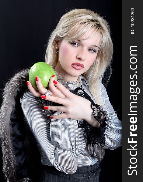 Girl in fur with green apple. Girl in fur with green apple