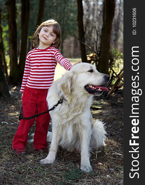 Friends - little girl with big retriever outdoor. Friends - little girl with big retriever outdoor