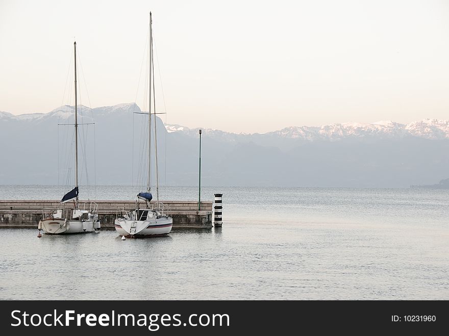 Two sailboats at the Garda lake in Italy