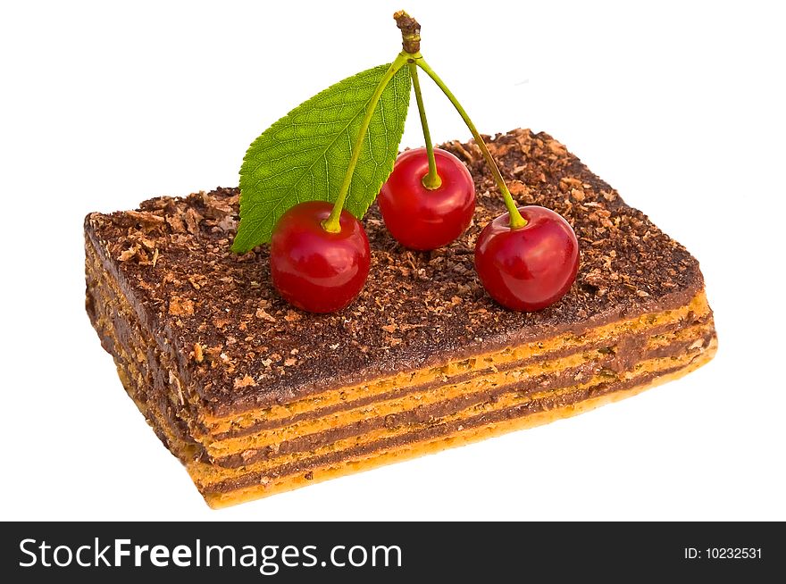 Wafer chocolate cake decorated with a cherry on a white background