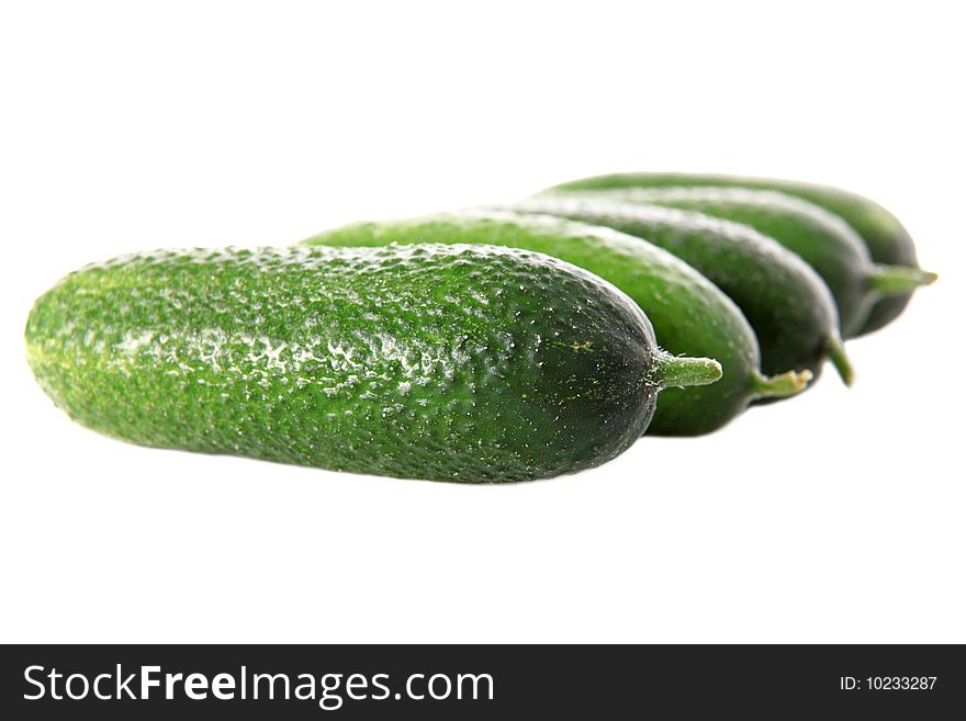 Green cucumbers isolated on white