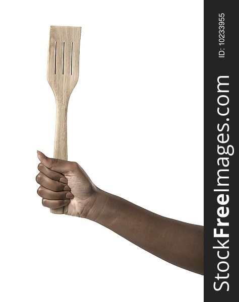 Hand Holding A Wooden Spatula