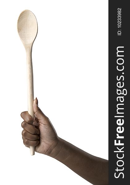 Hand Holding A Wooden Spoon